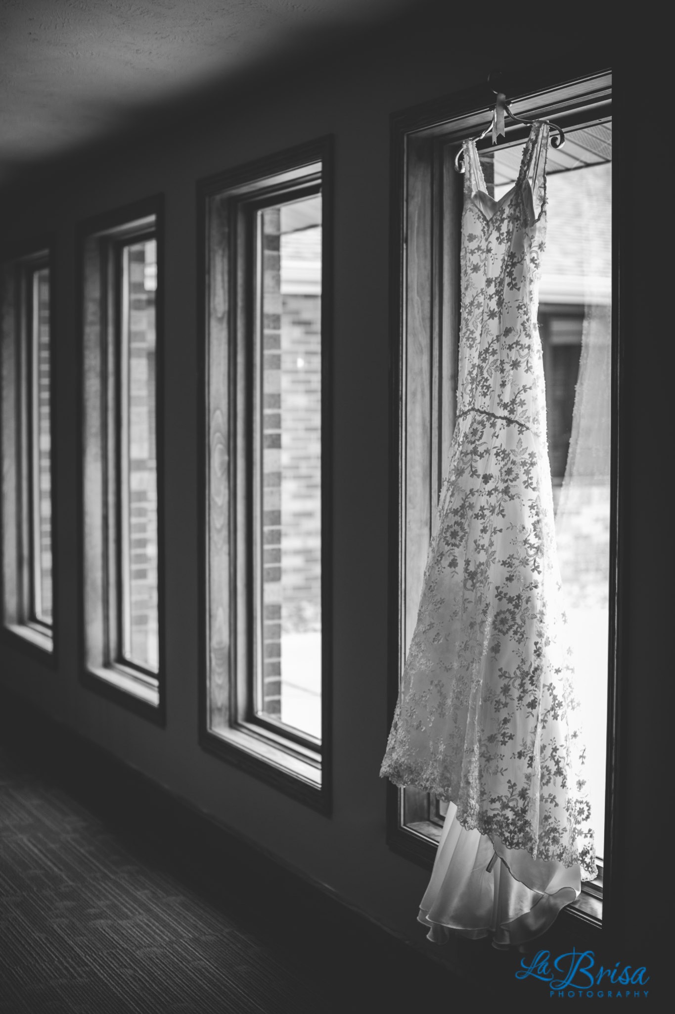 Wedding Dress Hung in row of windows