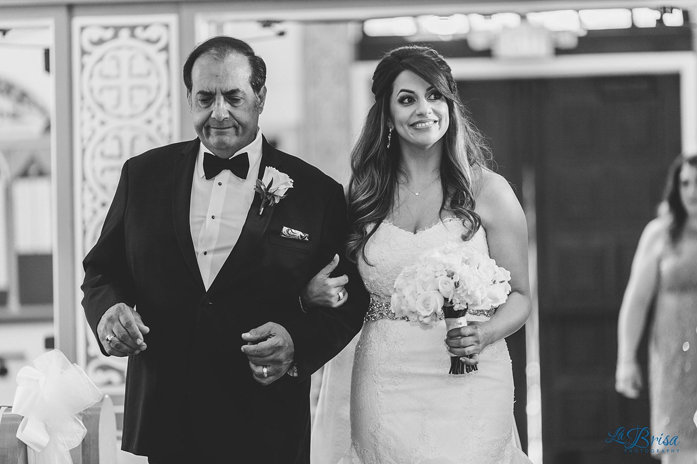 bride and dad walking down the aisle