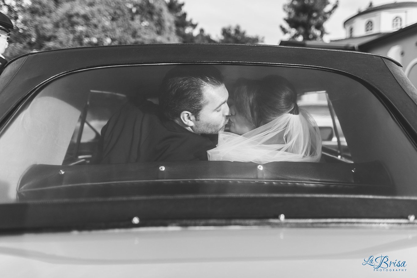 Bride Groom Kiss back of Rolls Royce