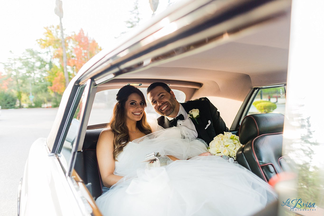 Bride Groom in back of Rolls Royce