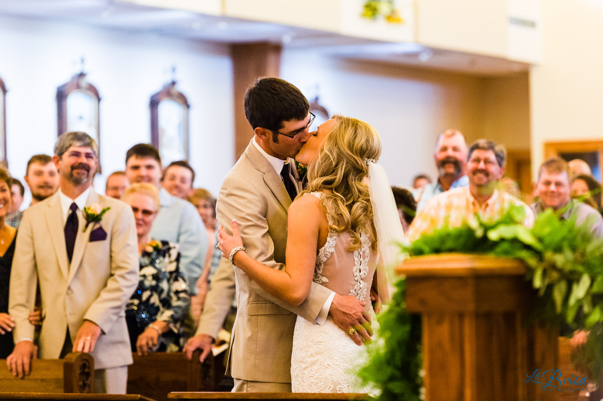 st bernard catholic church wedding ceremony bride groom first kiss