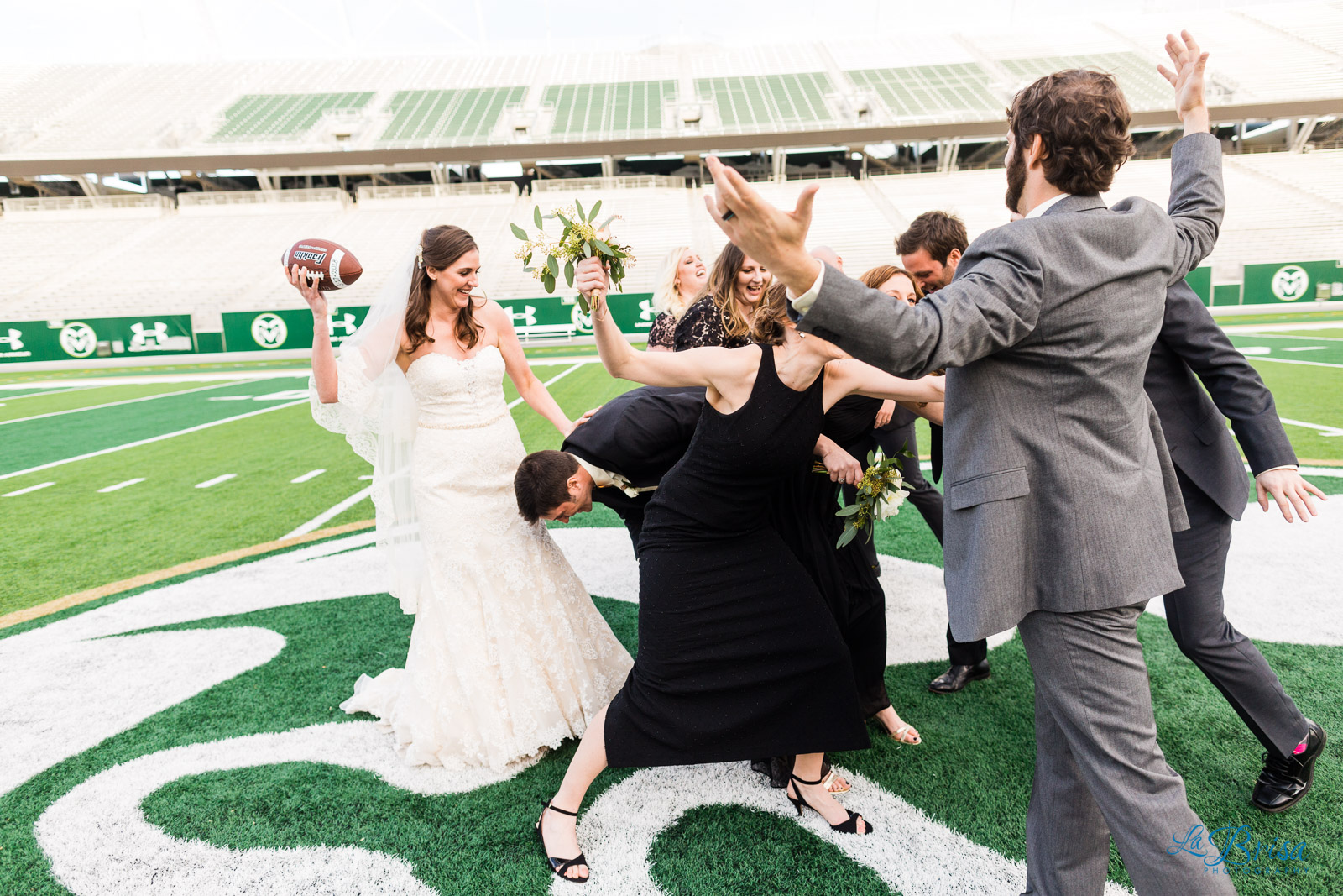 Wedding Party Playing Football Colorado State Football Field
