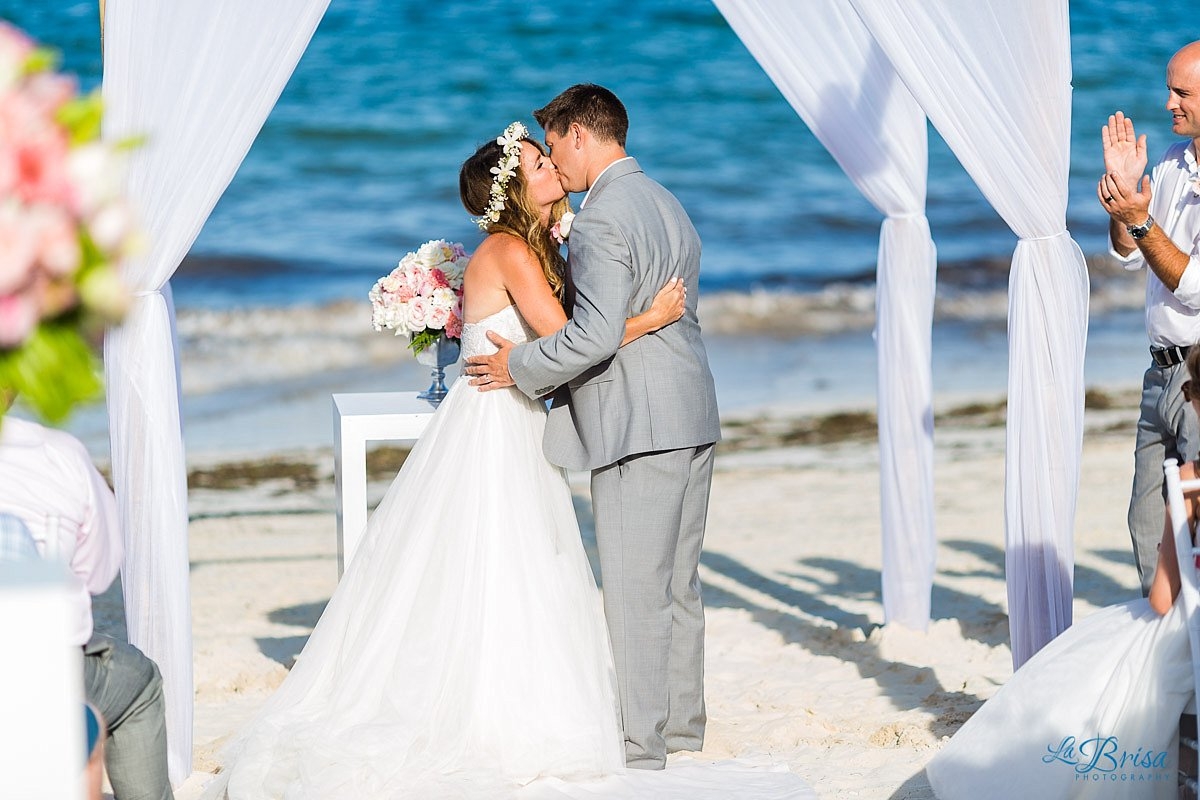 bride groom first kiss cancun beach wedding