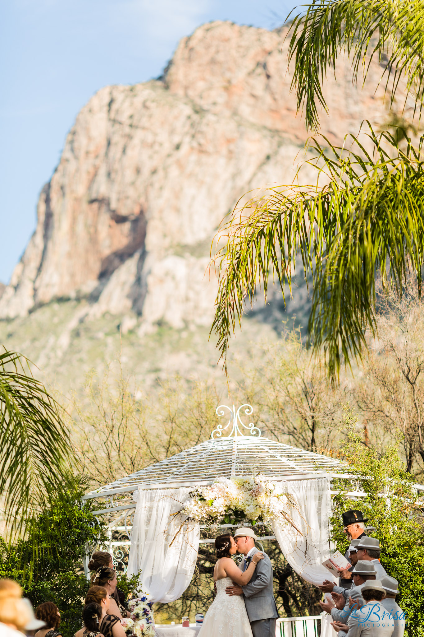 bride groom first kiss buttes at reflections wedding ceremony