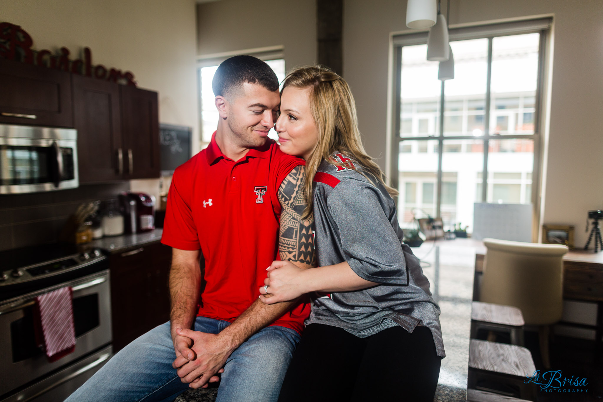 Texas Tech outfits sitting in kitchen engagement