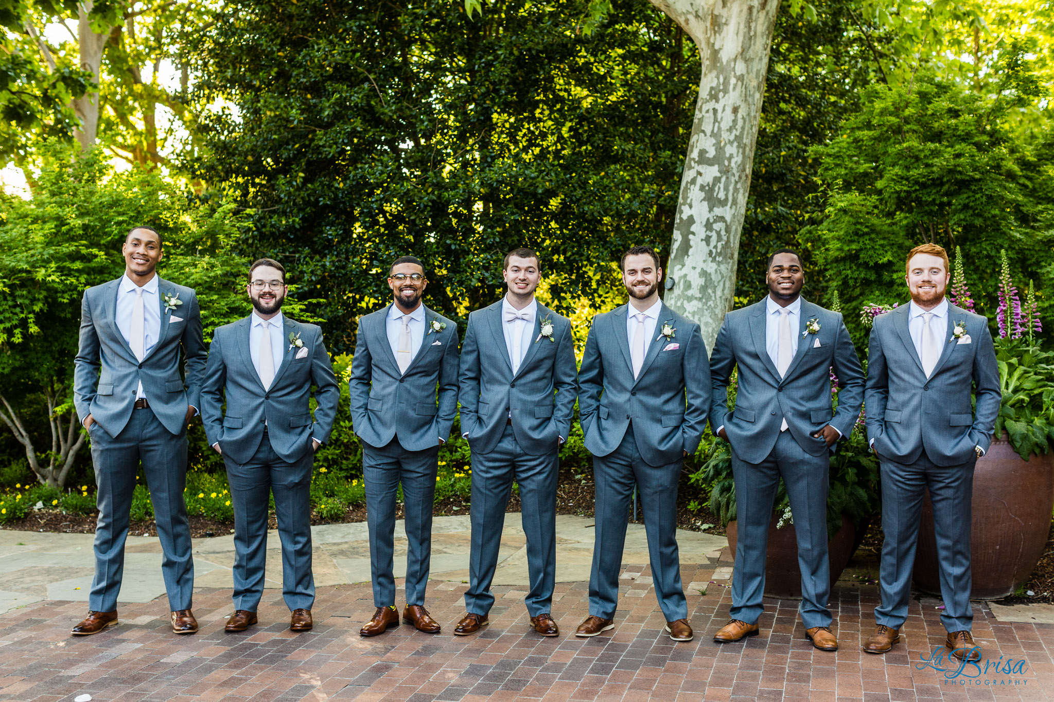 groomsmen pink ties grey suits