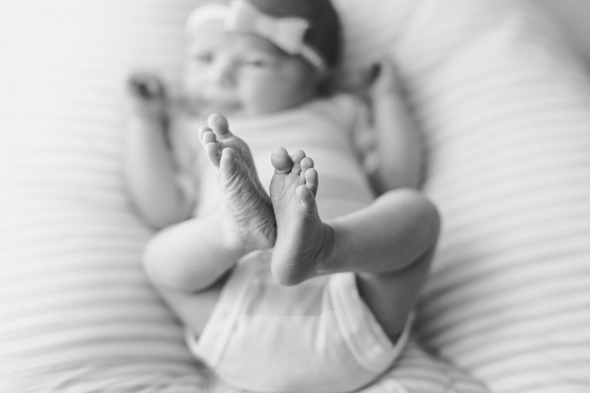 newborn baby feet in black and white