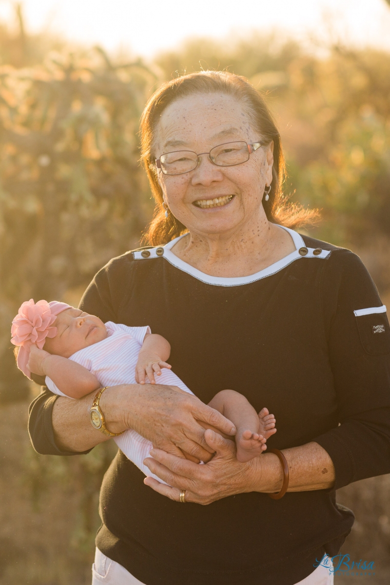 desert photo of grandma with newborn baby girl