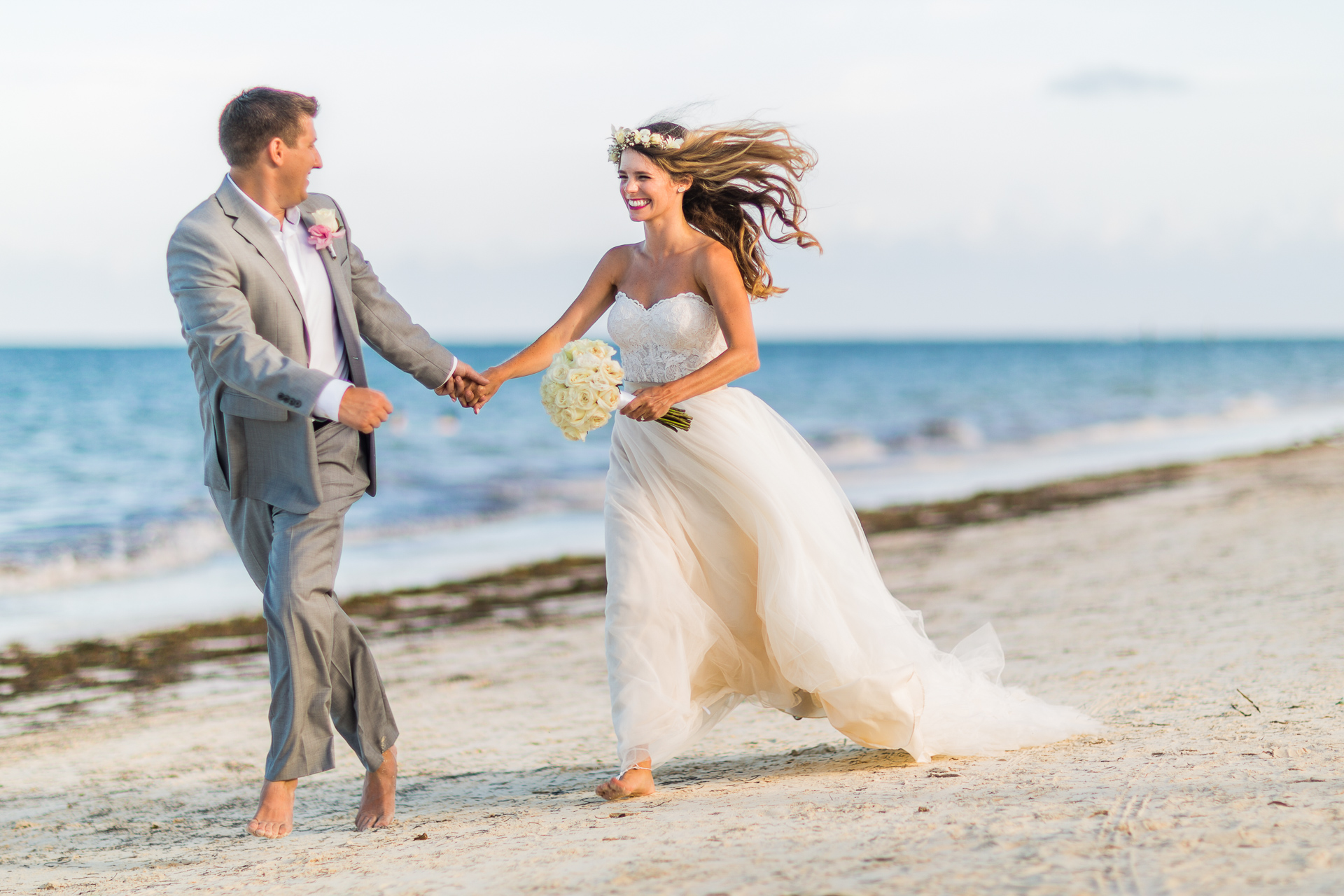 Bride Groom sprinting on beach cancun